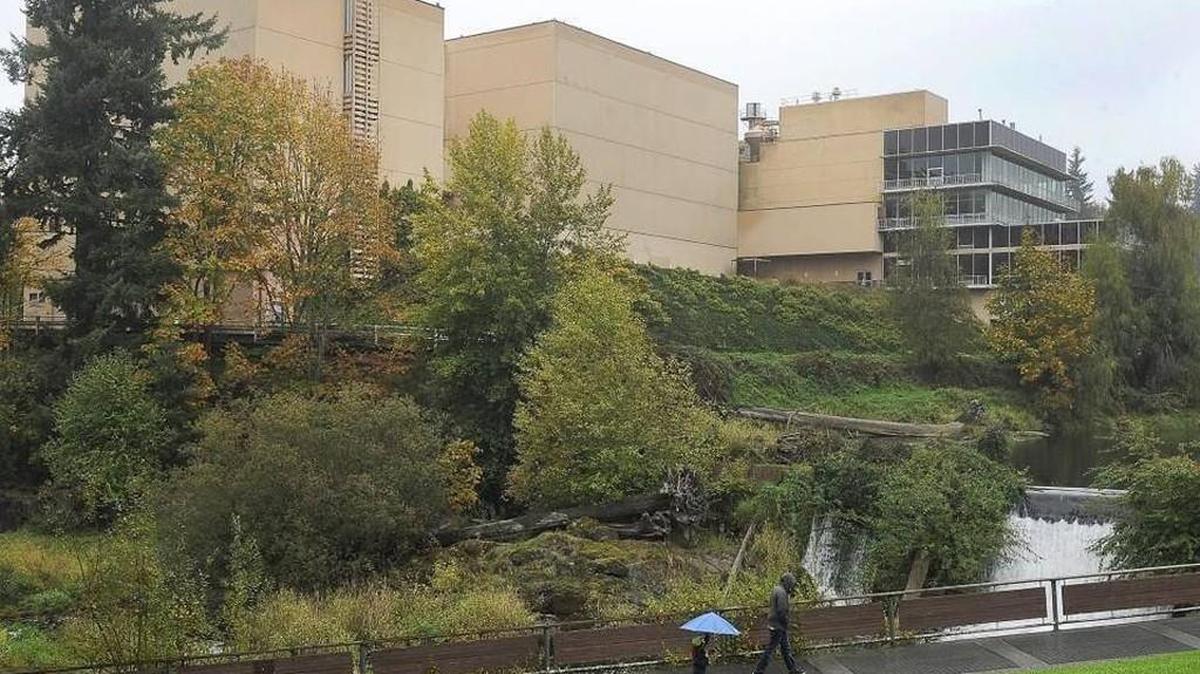 A steady mist falls on pedestrians Oct. 18 across from the long-vacant brewery site in Tumwater. The historic property has been sold for $4 million to an Anaheim-based development corporation, according to documents filed Thursday with the Thurston County Treasurer’s Office.