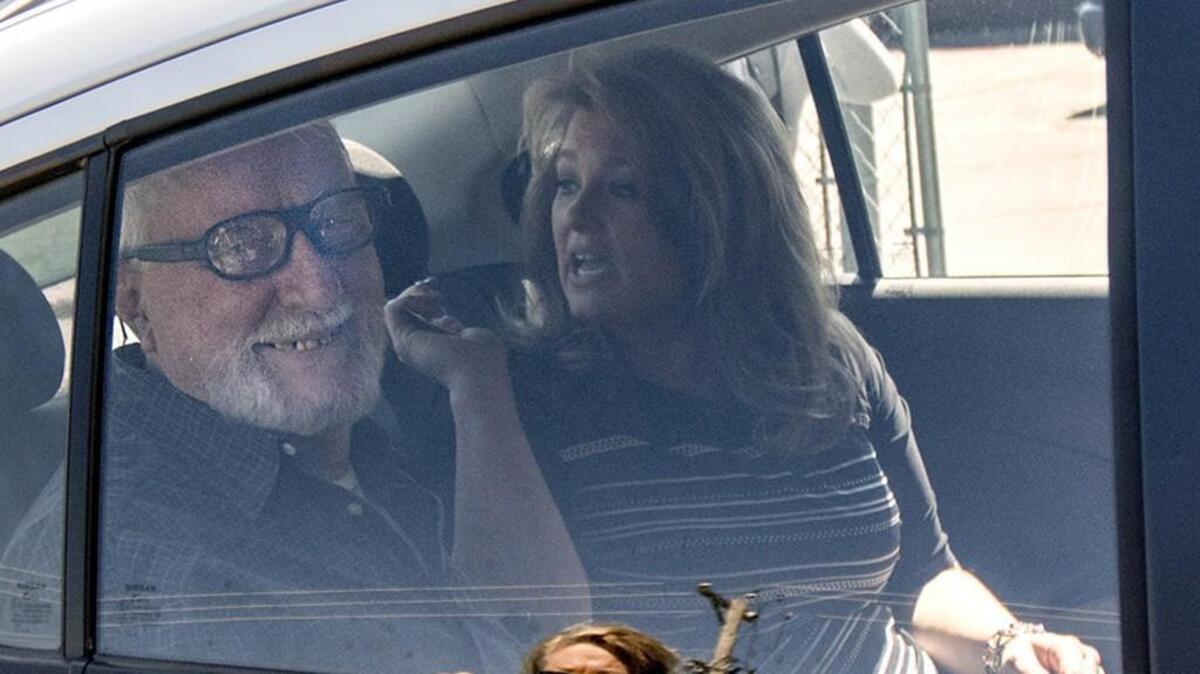 Jack McCullough, left, smiles from the backseat of his stepdaughter Janey O'Connor's rental car after he was released from the DeKalb County Jail in Sycamore, Illinoi, on Friday. An Illinois judge vacated the conviction of the 76-year-old man in a 1957 killing and ordered his immediate release from prison.