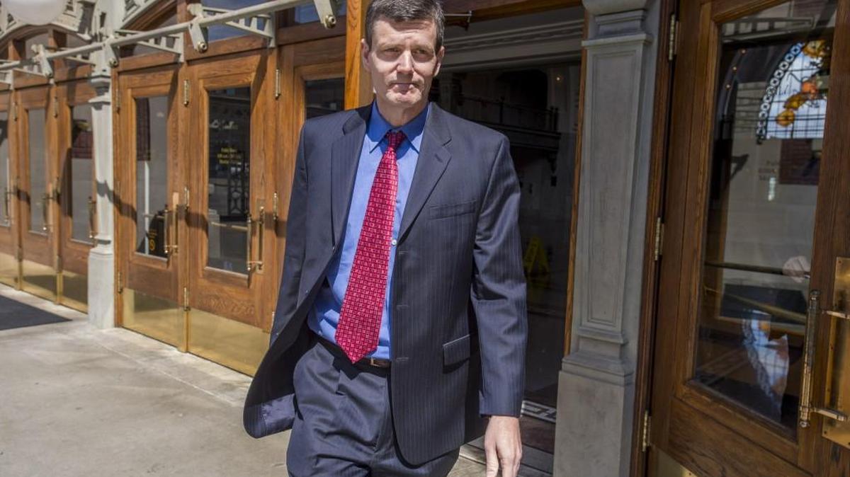 Troy Kelley walks out of the Federal Courthouse in downtown Tacoma last April.