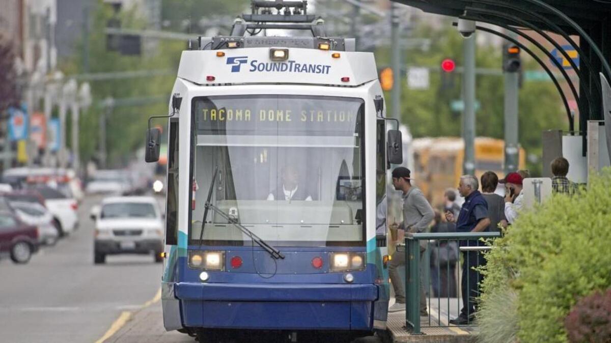 A Link light rail train operated by Sound Transit runs along Pacific Avenue in Tacoma in June 2013.