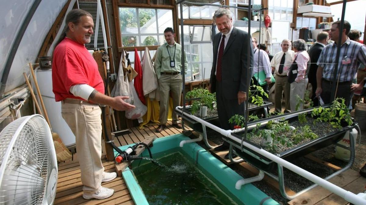 
Ed Stahl, a Cedar Creek Corrections Center inmate and lead on the tilapia fish program, explains the project to visiting Corrections Secretary Bernie Warner (center) during an on-site greenhouse tour August 4, 2011.
