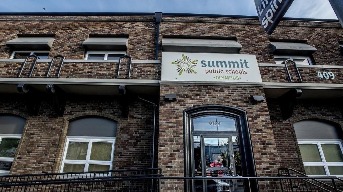 
A student peers outside the front door of Summit Olympus, one of three charter schools in Tacoma. 
