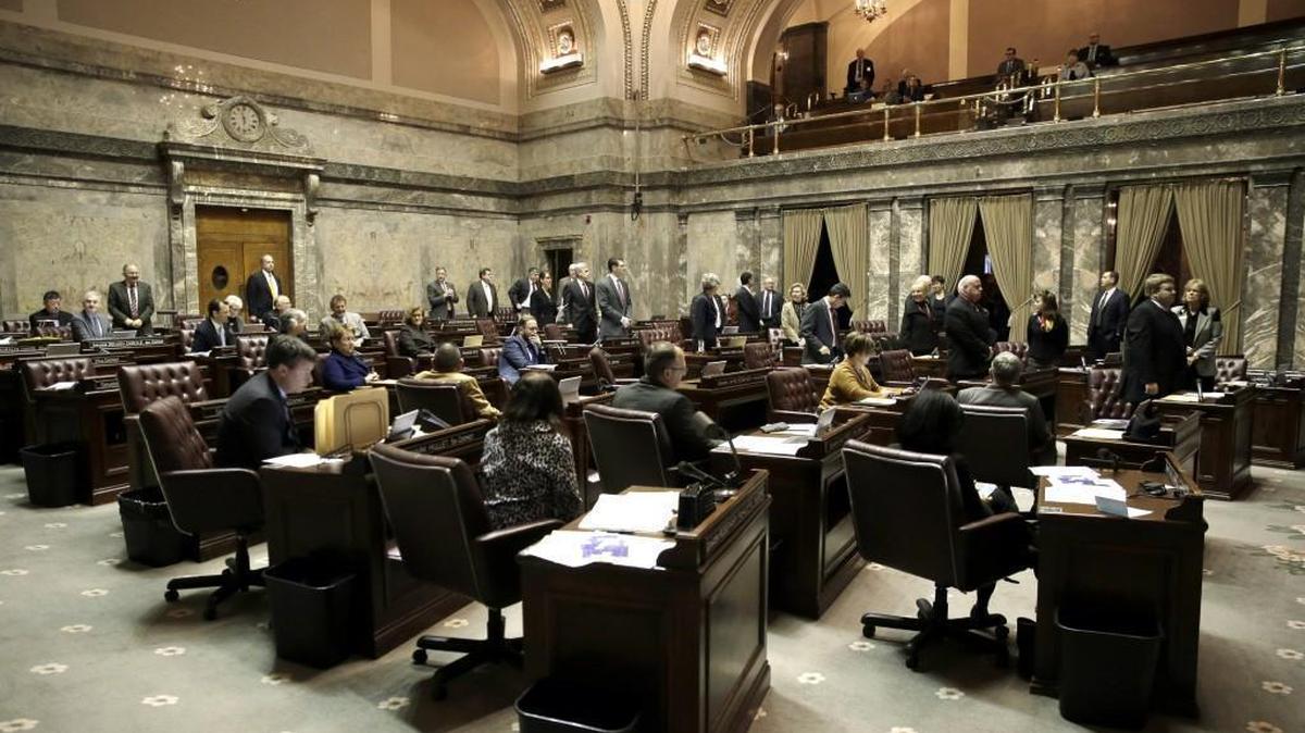 Washington state senators stand to indicate their votes on an amendment Wednesday, Jan. 20, 2016, at the Capitol in Olympia. The Senate passed a bill that seeks a legal fix to the state's charter schools in light of a state Supreme Court ruling that found the system unconstitutional.