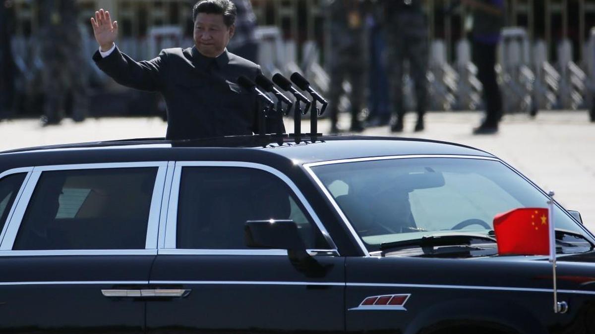 
Chinese President Xi Jinping stands in a car and waves this month during a troop review at a parade commemorating the 70th anniversary of Japan’s surrender during World War II held in front of Tienanmen Gate in Beijing. He is scheduled to visit the Puget Sound, including Tacoma, next week.
