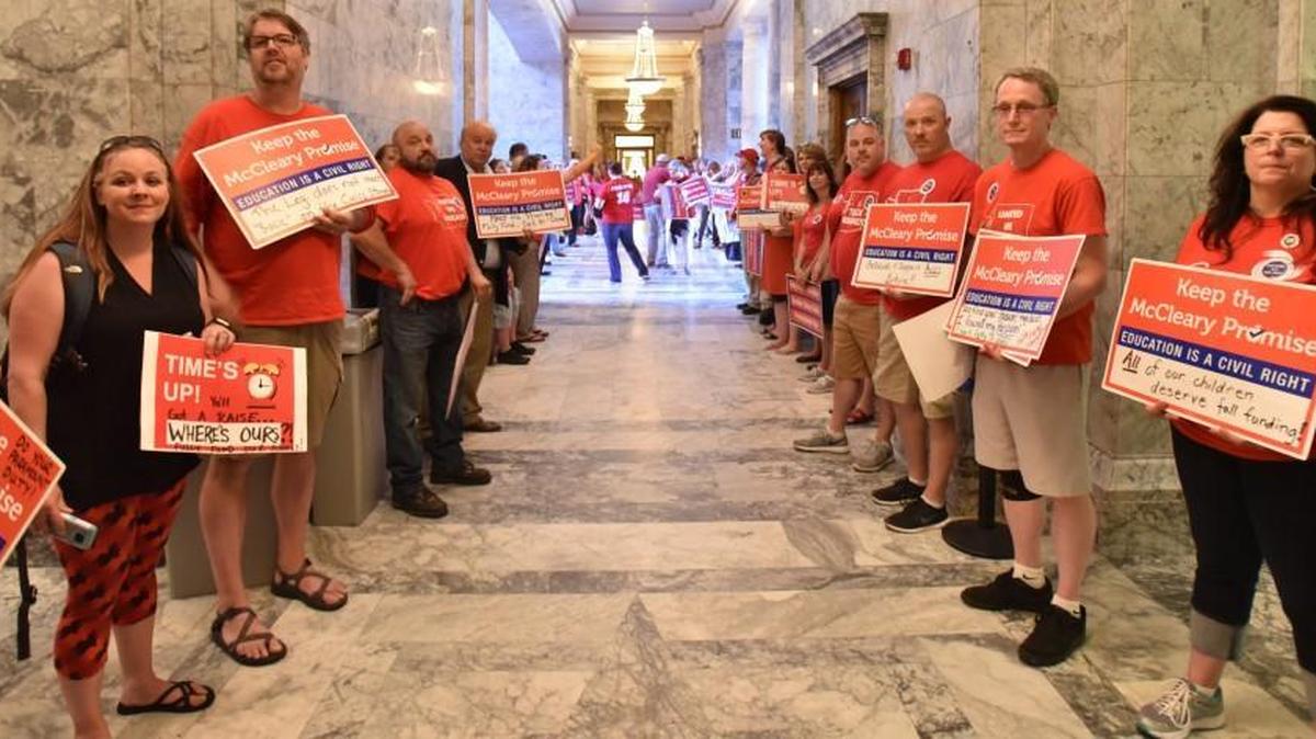 Members of the statewide teachers union descend on the Capitol Campus Tuesday, May 23 to rally for increased school funding as the Legislature finishes its first special session of 2017. Union members are urging lawmakers to reject the budget proposal from the Republican Senate majority. A new radio ad from the union makes some dubious claims about how the Republican proposal would hurt the state’s public schools.