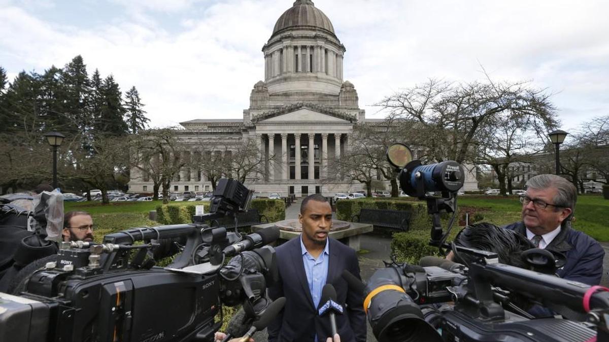 Seattle Seahawks NFL football wide receiver Doug Baldwin talks to reporters in November, after he testified in Olympia at a joint legislative task force on the use of deadly force in community policing. Baldwin, whose father was a police officer, has been outspoken on the issues of police training, racial profiling and the use of force by law enforcement officers.
