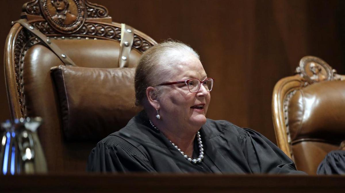 In this June 11, 2019, file photo, Chief Justice Mary E. Fairhurst looks on during a hearing before the Washington Supreme Court in Olympia, Wash. Fairhurst has announced she will retire in January, 2020. Fairhurst has been working while undergoing treatment for her third bout of cancer. Gov. Jay Inslee will appoint a new justice who will fulfill the remaining year of Fairhurst’s term.