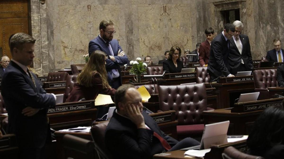 Senators watch the vote count on their computers on a bill that sought to eliminate Washington’s new rule allowing transgender people to use bathrooms and locker rooms in public buildings consistent with their gender identity, Wednesday, Feb. 10, 2016, in Olympia. The measure failed by one vote, with three Republicans joining Democrats to vote against it.