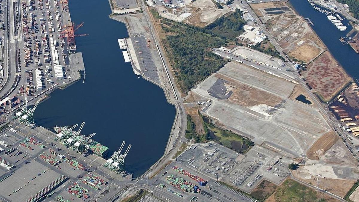 The site of the proposed Northwest Innovation Works methanol plant is the cleared area to the right in this aerial photo. The Blair waterway is the large body of water on the left. The area was the former site of the Kaiser Aluminum smelter.
