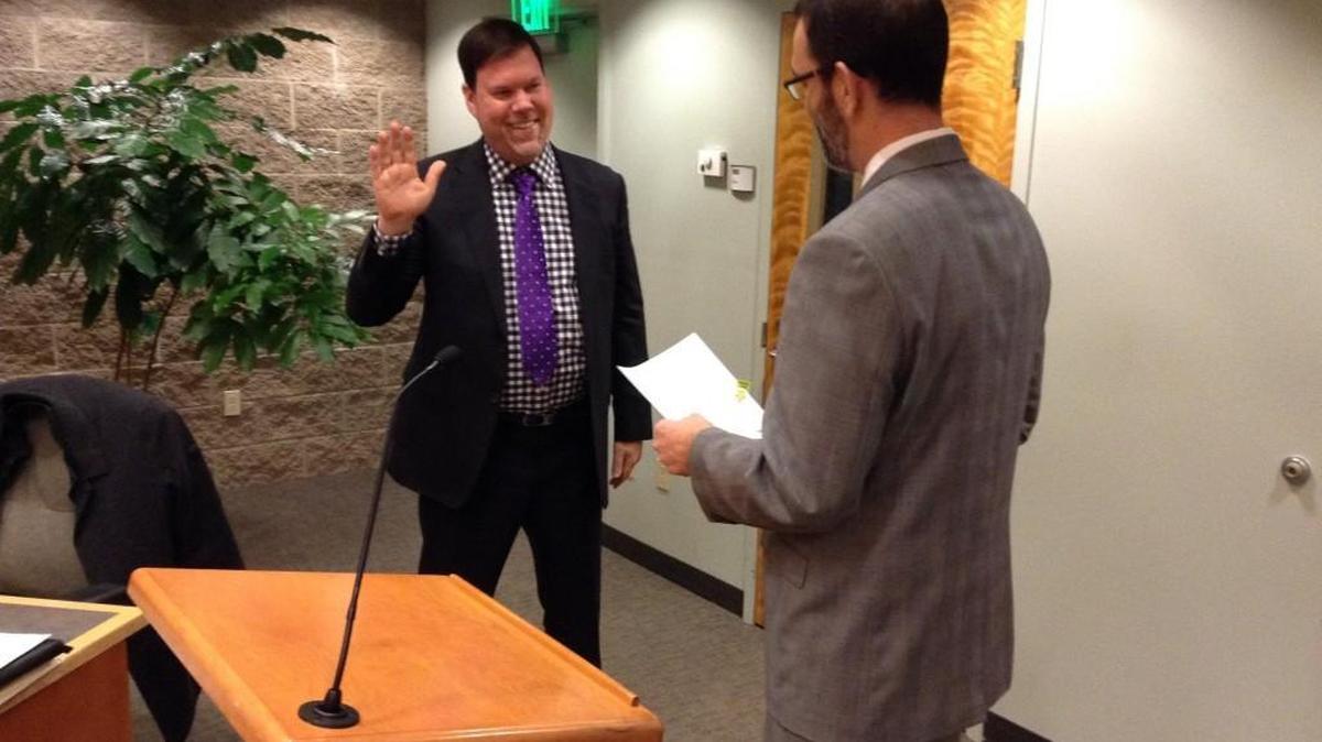 Lacey Mayor Andy Ryder takes the oath of office during Thursday night’s council meeting. Lacey mayor serves a two-year term.