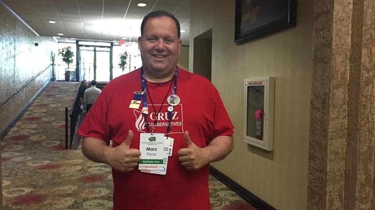 Marc Perez, a delegate from Puyallup, dons his “Cruz Conservative” shirt after a breakfast for Washington RNC delegates. He wore the shirt to a Ted Cruz event in Cleveland Wednesday afternoon.