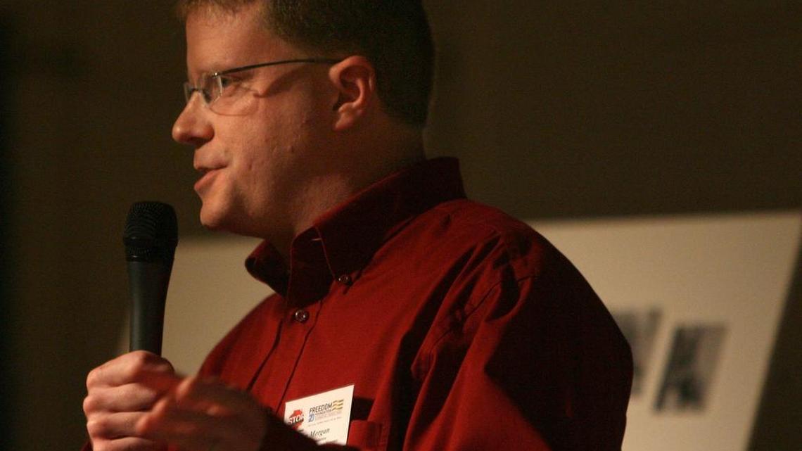 STOP Thurston County organizer Glen Morgan speaks to a crowd at Rochester’s Swede Hall in 2011. Morgan is leading two political action committees that have sponsored robocalls this election season targeting Thurston County Commission candidate Jim Cooper. He is being sued by two Thurston County residents, who take issue with robocalls going to their cellular phones.