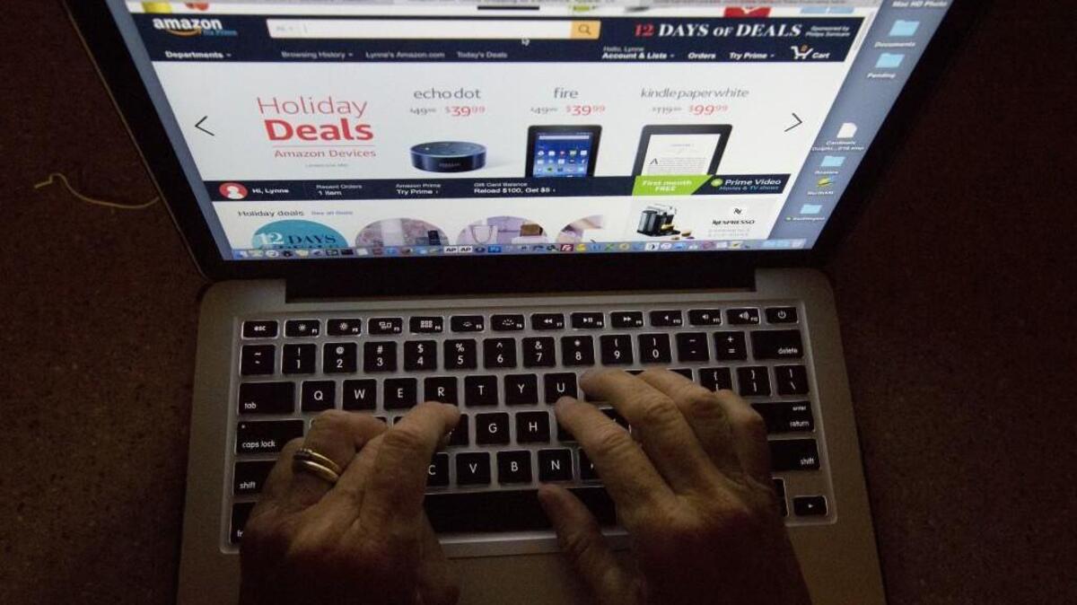 A shopper in Miami searches an online retailer’s site. The Legislature is considering a state tax on online shopping.