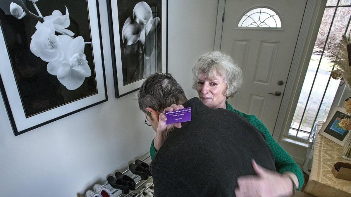 Madeleine Fraley’s simple idea, to hand out a purple card alerting people to her husband Larry’s dementia and asking for their patience, is the basis for House Bill 2835, which would task DSHS with developing a similar card as part of the state’s Alzheimer’s plan required by 2014 legislation. Fraley, of Port Orchard, was showing the card Wednesday, Feb. 2 to a photographer from The News Tribune when her husband Larry came over to give her a hug, causing tears to well in her eyes. Fraley believes the card is a small but significant way to help maintain her husband’s dignity.