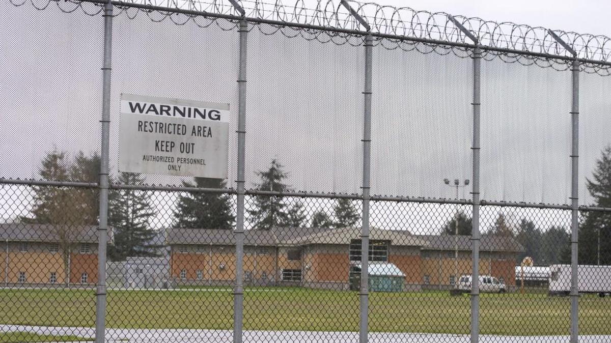 The Maple Lane Competency Restoration Program will be conducted inside the secure perimeter surrounding the grounds of the former youth correctional facility in Grand Mound near Centralia. The fence webbing in the upper section is too fine to climb.