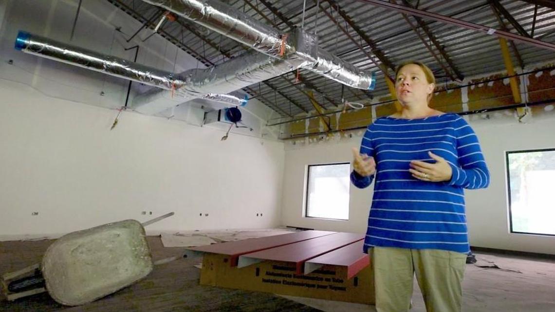Offering a facilities tour July 14, Kelly Green, chief communications and legislative affairs officer for South Puget Sound Community College, stands in the former library currently undergoing a full renovation. Last week, SPSCC’s Board of Trustees voted to use $980,000 of the Olympia college’s reserves to bankroll completion of a renovation, instead of holding off for passage of a state capital budget.