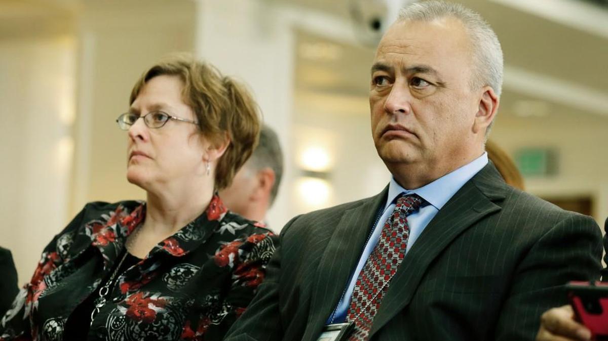 Washington state Corrections Secretary Dan Pacholke, right, and Deputy Secretary Jody Becker-Green, left, listen to testimony Monday in Olympia, Wash., during a Senate Law and Justice Committee hearing to investigate a software coding error at the DOC that led to the early release of up to 3,200 prisoners in Washington state since 2002 because of miscalculated sentences.
