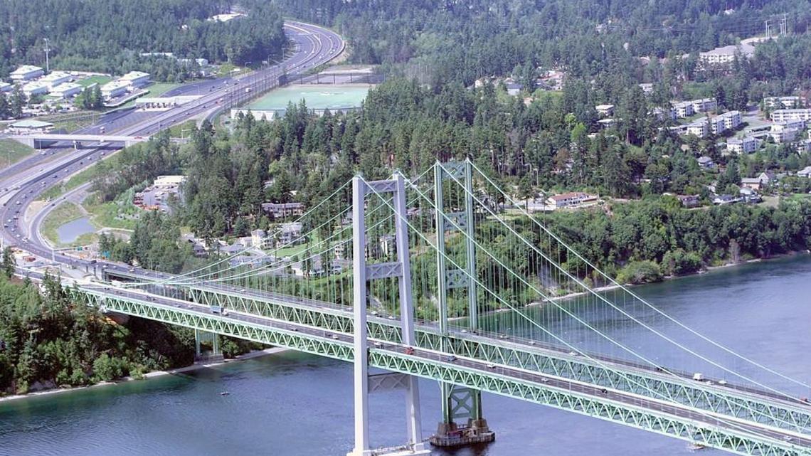 The old and new Tacoma Narrows Bridges are shown shortly after the new bridge’s 2007 opening.
