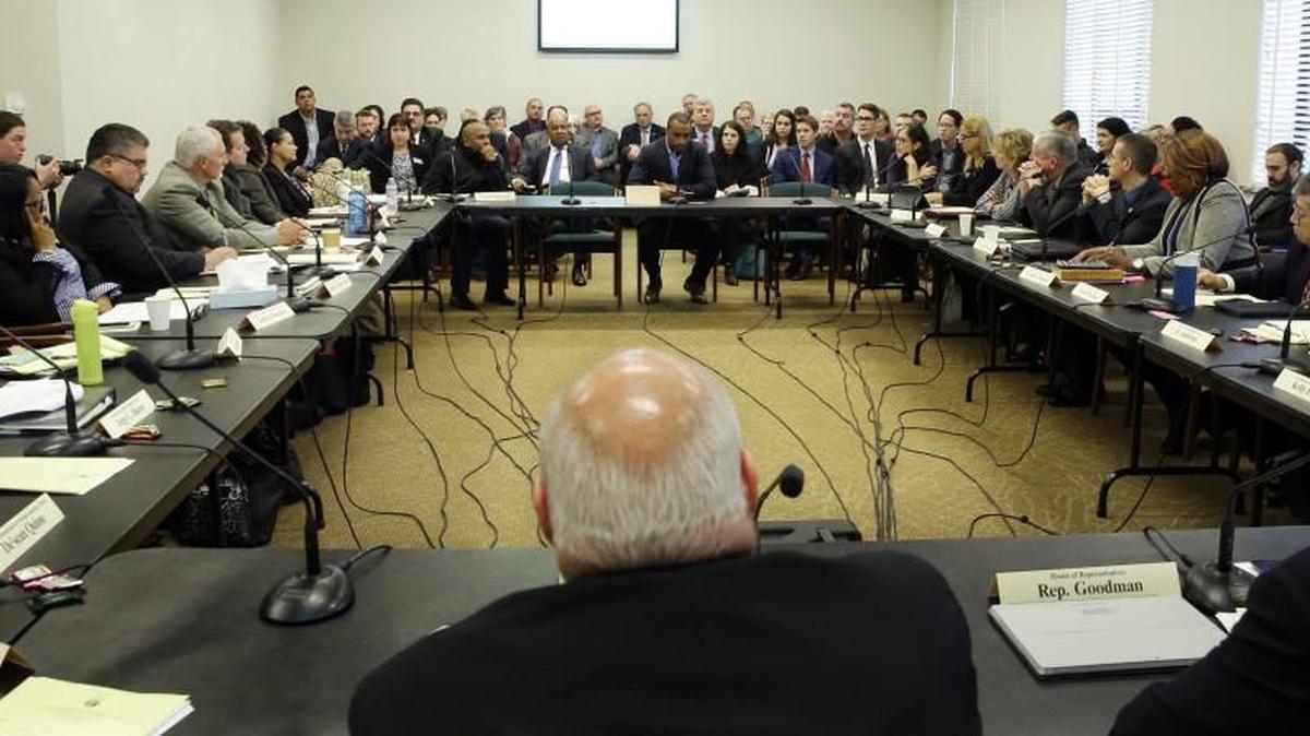 Seattle Seahawks wide receiver Doug Baldwin, seated center at the far rear table, prepares to speak Monday to the Joint Legislative Task Force on Use of Deadly Force in Community Policing at the Capitol in Olympia. Baldwin, whose father was a police officer, has been outspoken on the issues of police training, racial profiling and the use of force by law enforcement officers.