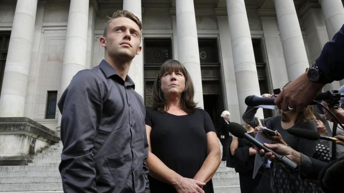 Stephanie McCleary, right, and her son Carter McCleary, 17, left, talk to reporters Wednesday, Sept. 7, 2016, in Olympia, Wash., following a Washington State Supreme Court hearing on the ongoing battle surrounding the state's constitutional requirement to properly fund basic education. Stephanie McCleary is one of the plaintiffs in the case.