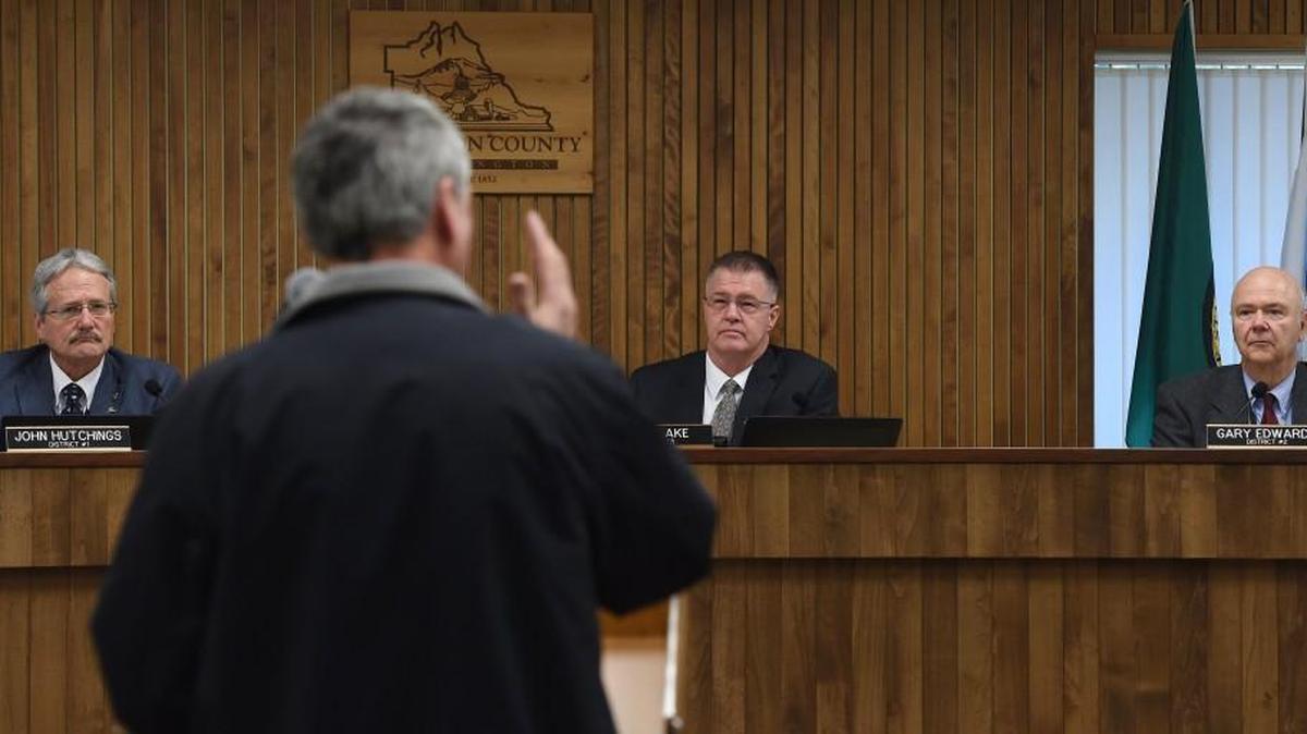 Commissioners John Hutchings, Bud Blake and Gary Edwards listen to public comment as the all-independent Thurston County Commission holds their first meeting Jan. 3rd, 2017. One of the board’s first personnel decisions was to ask the director of Public Health and Social Services to resign.