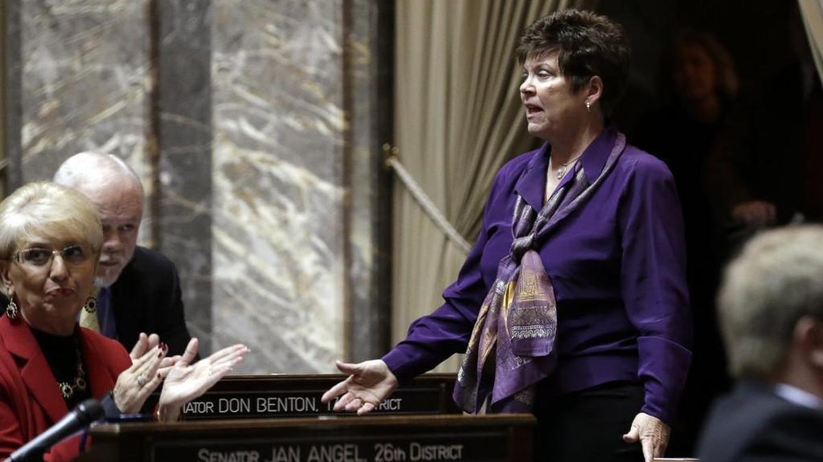 Sen. Pam Roach, R-Auburn, stands and is applauded Jan. 12, 2015, after being elected as president pro tempore in the Senate at the start of the legislative session.