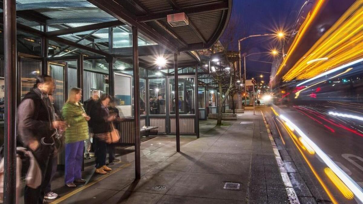 Commuters wait for a Sound Transit Express bus heading for Seattle in 2016 at the Tacoma Dome Station. Lawmakers and taxpayers have been outraged by the increased cost of car-tab fees under Sound Transit 3, the $54 billion transit package voters approved in November. But lawmakers were the ones who authorized Sound Transit to collect those taxes — and provided the specific means for doing so — in 2015.