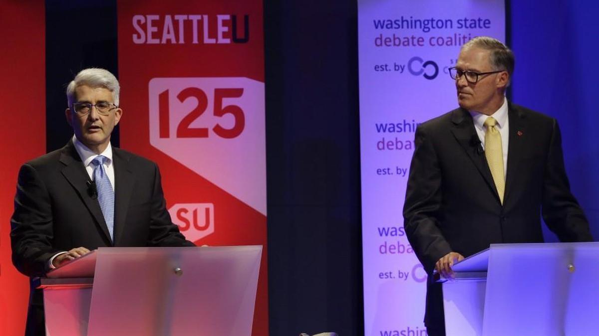 Washington Gov. Jay Inslee, right, a Democrat, and his Republican challenger, Bill Bryant, left, take part in a debate, Monday, Sept. 26, 2016, in Seattle. The two candidates will appear together in Tacoma at a City Club forum Nov. 2.