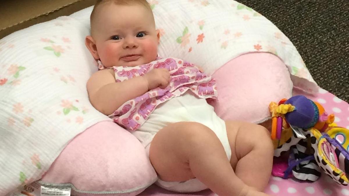 
Erica Stineman has been bringing her daughter Lydia, shown here, to work with her at the Washington Traffic Safety Commission as part of the agency’s pilot program allowing infants at work. Stineman said having the 4-month-old at her side has been a huge benefit.
