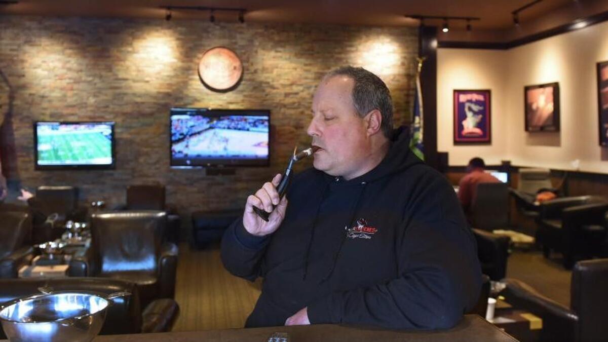 Sitting in the Cigar Daddies' cigar club area in Lacey on Saturday co-owner Chance Wehrer hopes potential changes in state law will help ease operation limitations on cigar smoking for private clubs.