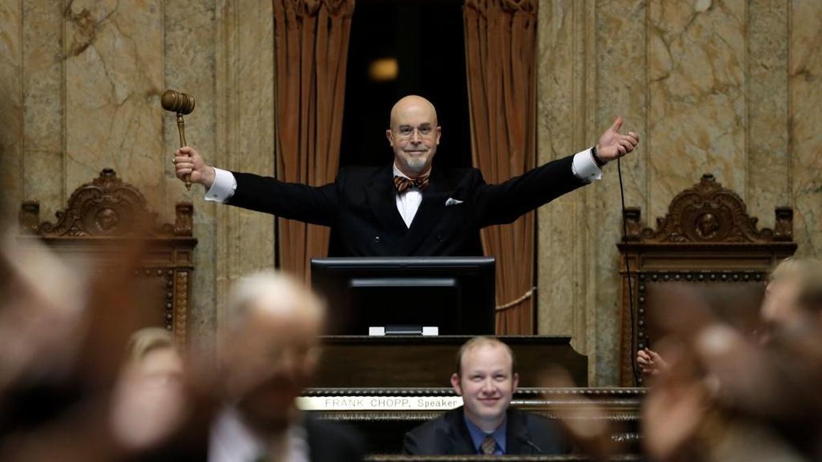 Rep. Jim Moeller, D-Vancouver, and Speaker Pro Tempore of the Washington House, raises his gavel after declaring “Sine Die” on Thursday to end the regular session of the Washington Legislature at the Capitol in Olympia.