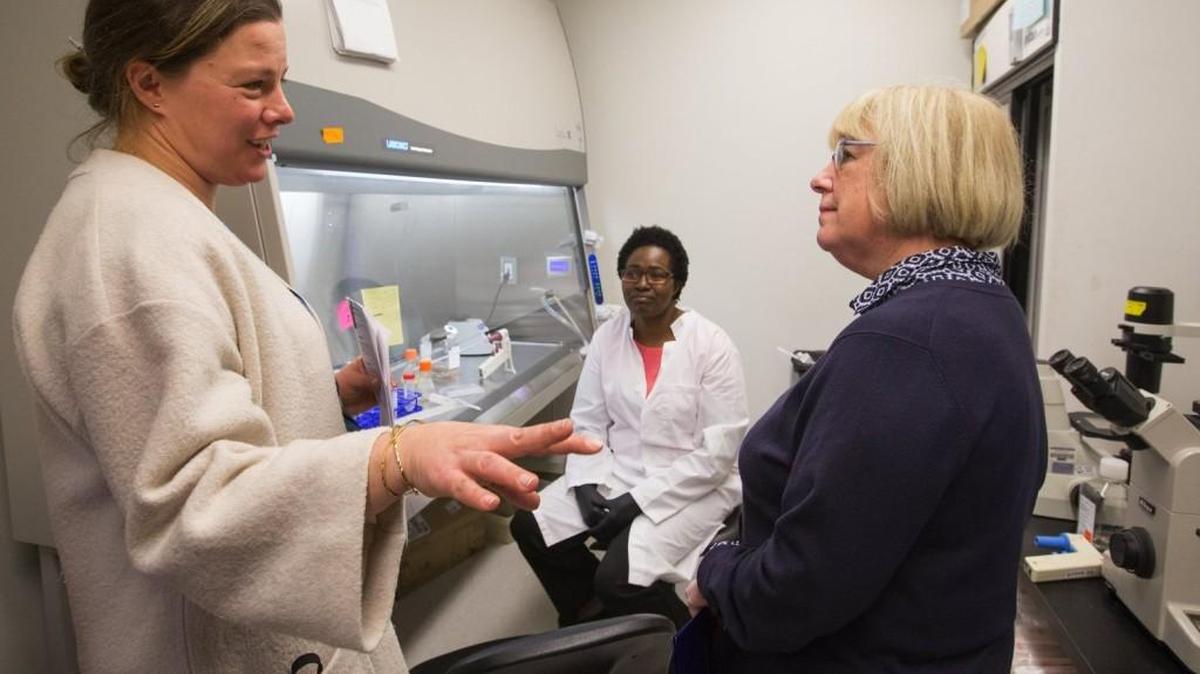 U.S. Sen. Patty Murray, right, speaks with Dr. Marion Pepper of the UW Medicine Department of Immunology at one of the UW’s South Lake Union research facilities. In the background is Gladys Keitany, a post-doctorate fellow who works in the lab.