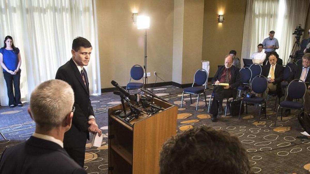 
Washington State Auditor Troy Kelley looks at his attorneys during an April press conference in Tacoma.
