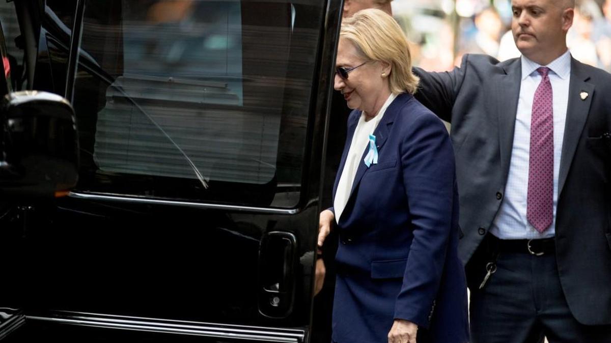Democratic presidential candidate Hillary Clinton gets into a van as she departs an apartment building Sunday, Sept. 11, 2016, in New York. Clinton's campaign said the Democratic presidential nominee left the 9/11 anniversary ceremony in New York early after feeling "overheated."