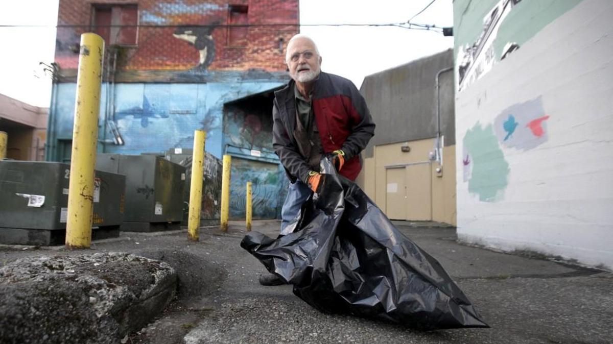 Wearing rubber gloves and carrying a trash bag longtime area real estate developer Steve Cooper goes on his regular weekday morning ritual of picking up discarded garbage strewn across some of his downtown Olympia properties and parking lots.