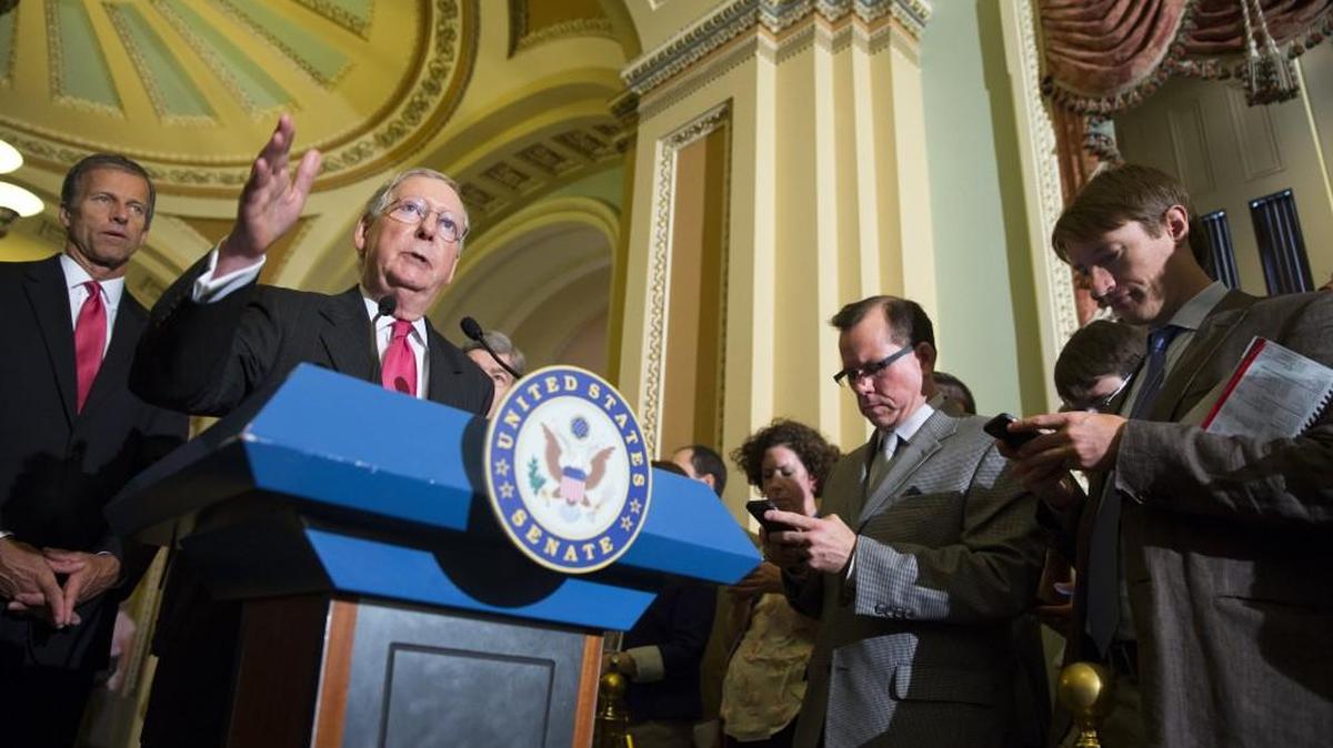 
Senate Majority Leader Sen. Mitch McConnell of Ky., accompanied by Sen. John Thune, R-S.D., talks about a possible government shutdown during a news conference after a policy luncheon on Capitol Hill in Washington, Wednesday, Sept. 16, 2015. 
