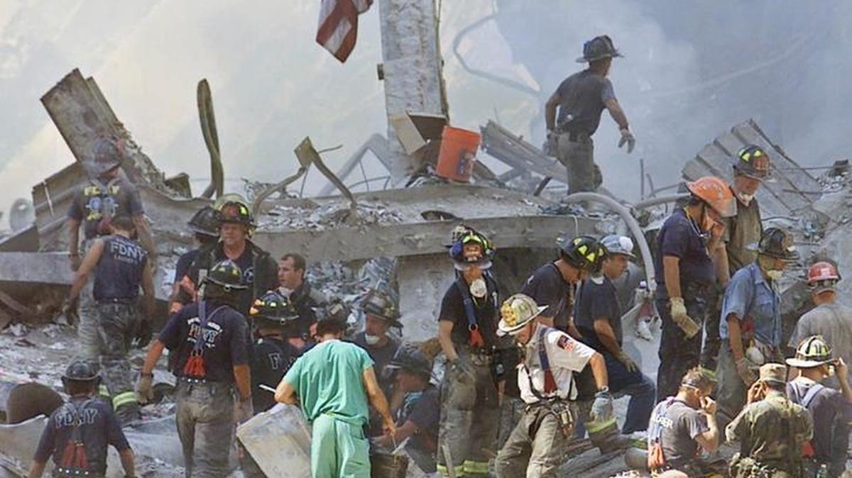 An American flag is posted in the rubble of the World Trade Center in this Sept. 13, 2001 file photo, in New York.