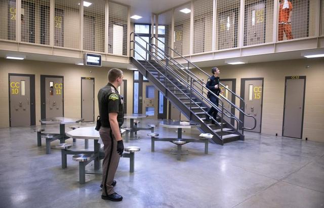 Sheriff’s deputies make rounds through the maximum security unit at the Thurston County jail in Tumwater.