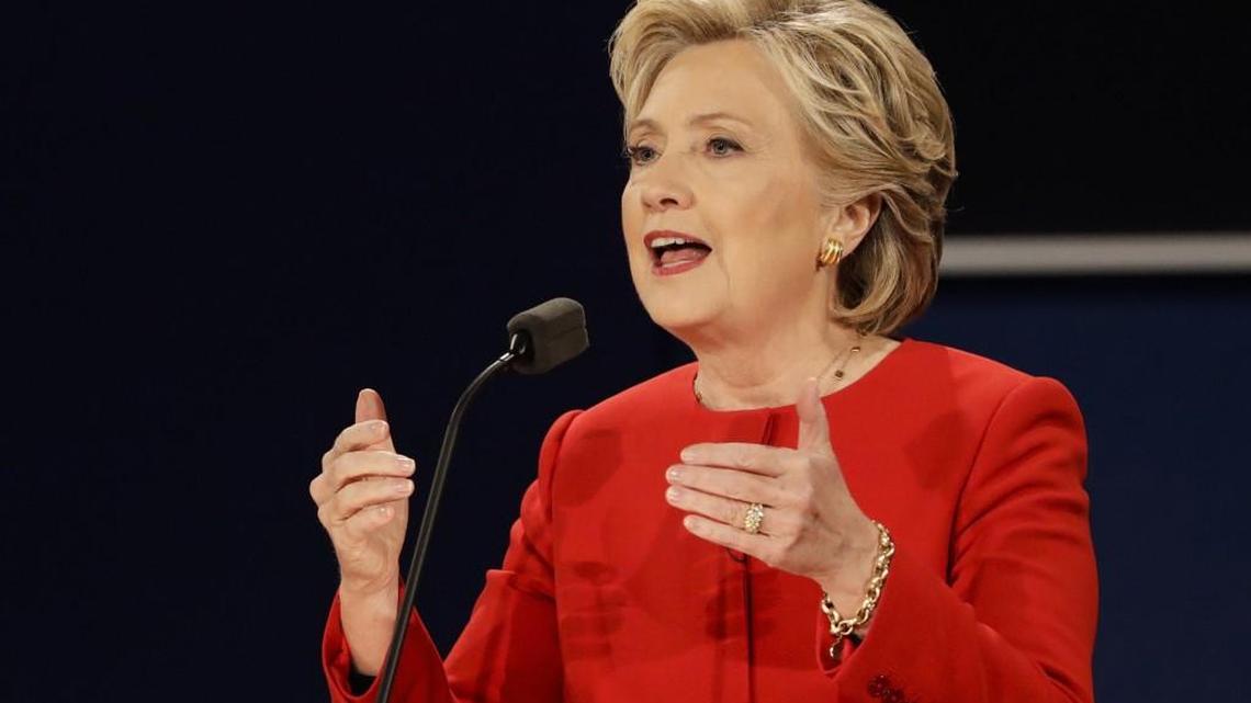 In this Sept. 26, 2016, photo, Democratic presidential candidate Hillary Clinton answers a question during the presidential debate with Republican presidential candidate Donald Trump