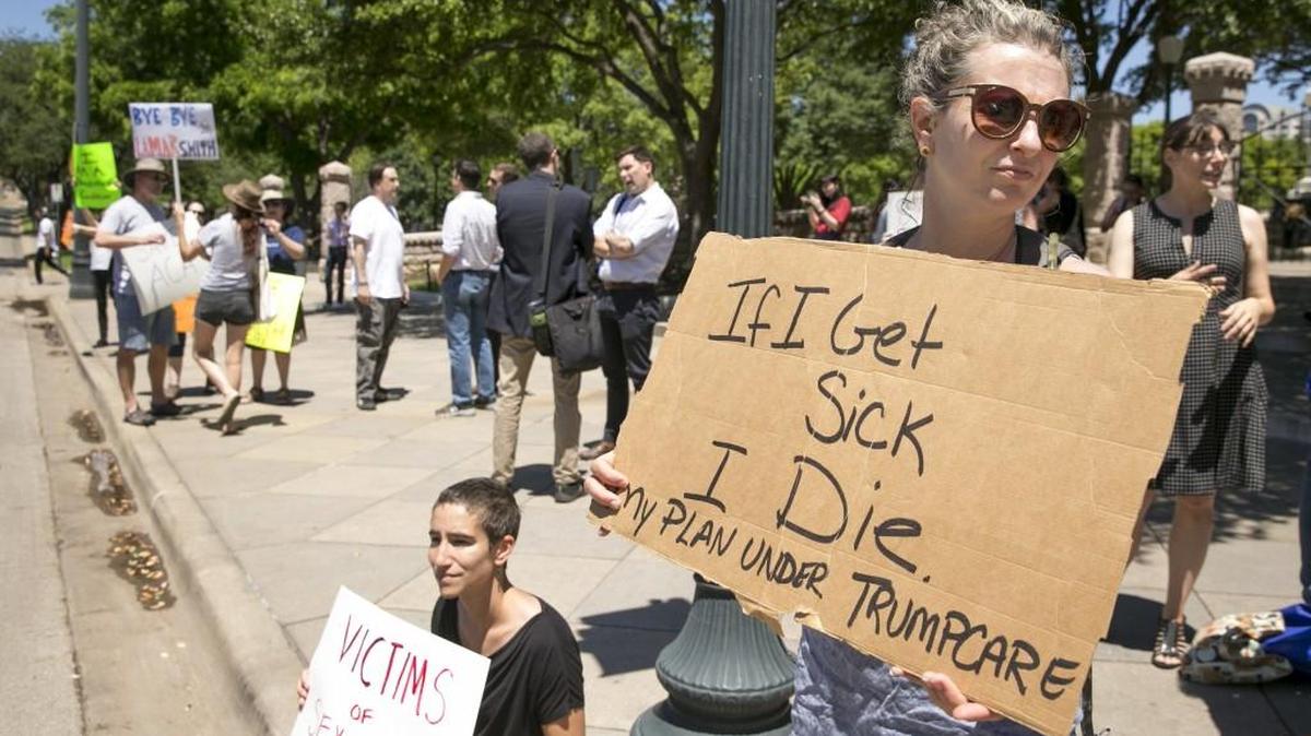 Sophia Donnelly protests the U.S. House passage of the plan to repeal and replace the Affordable Care Act at the south gate of the Capitol in Austin, Texas, on Friday May 5, 2017.