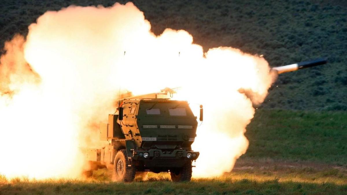 Flames engulf the launch truck as soldiers fire the High Mobility Artillery Rocket System (HIMARS) during combat training in the high desert of the Yakima Training Center