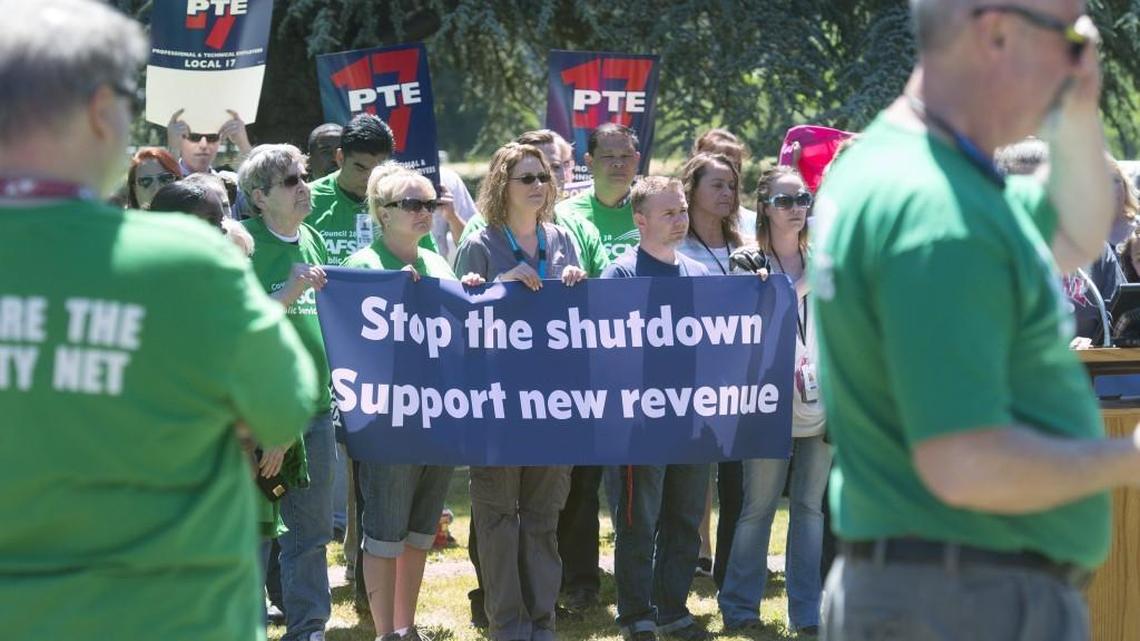 Washington state workers rally to encouraged state legislators to solve the budget stalemate and avoid a partial government shutdown during a rally outside Western State Hospital in Lakewood in Thursday, June 22, 2017.