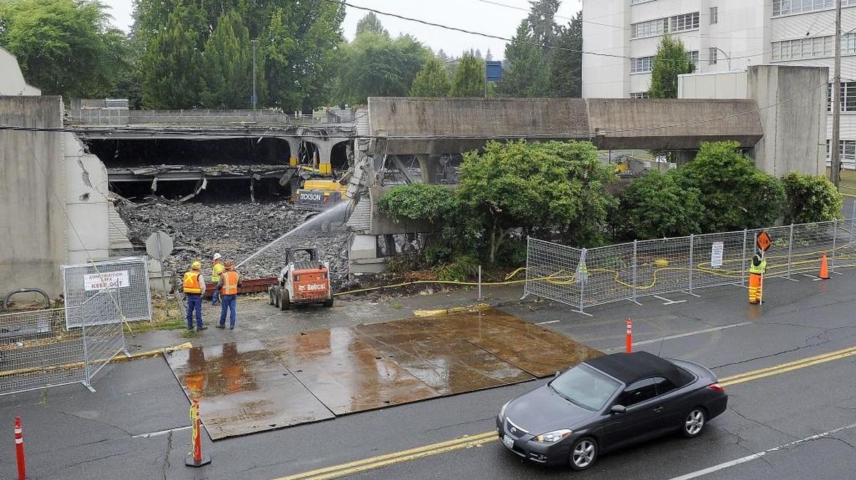 
As part of the 1063 Block Replacement project, a work crew from Sellen Construction continues the demolition of a state-operated parking garage at 124 Union Ave. SW, Monday, Sept. 14, 2015. Upon completion of the garage demolition, the company will then turn its attention to the adjacent office building located at 1063 Capitol Way S. ,beginning on the 11th Avenue side of that structure.

