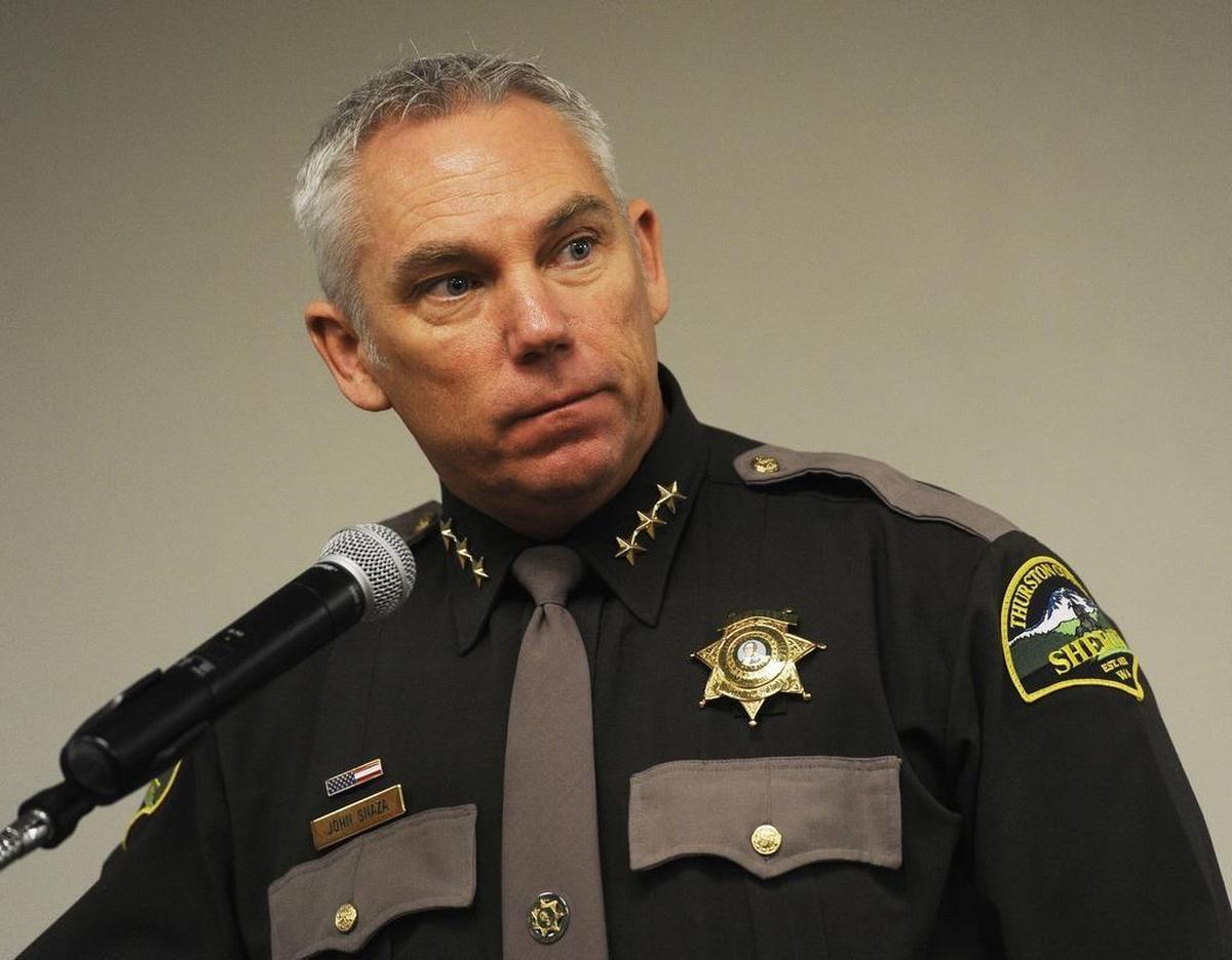 Thurston County Sheriff John Snaza was vacationing in Montana in August 2016 when he was involved in a near-fatal motorcycle crash. Snaza was not wearing a helmet since it is not mandatory for adult riders in that state.