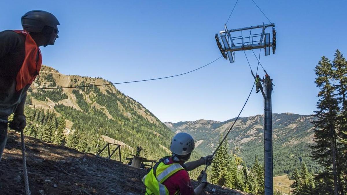 A crew from Skytrac installs part of a tower on the Quicksilver ski run at Crystal Mountain on Oct. 6, 2014. The lift was ready for last season, but poor weather meant that Crystal’s other new lift saw limited action.