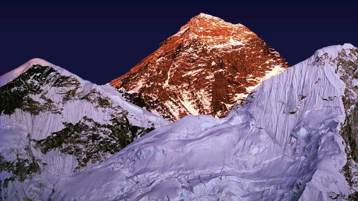 
A golden glow envelopes Mount Everest, center, as the sun sets on a November day in 1983 as seen from a trail in Nepal to the worlds highest mountain.
