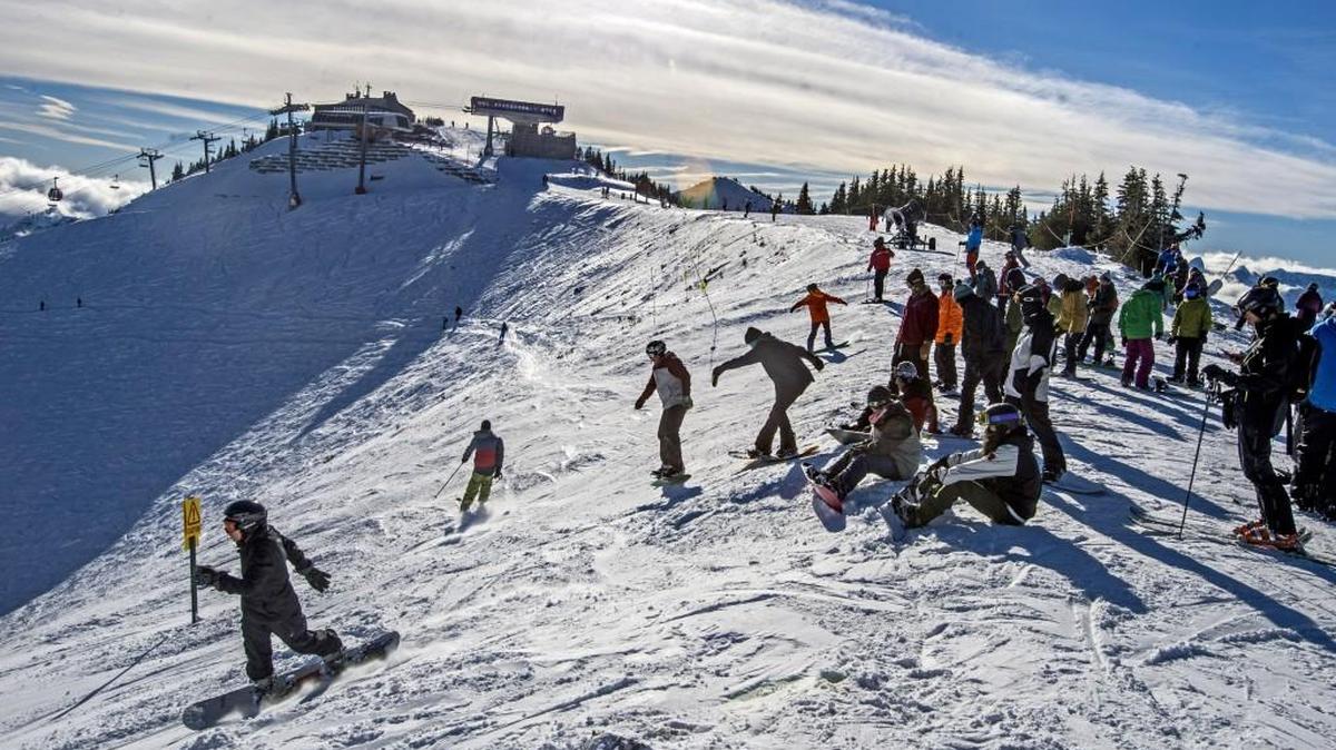 Skiers and snowboarders enter Green Valley atop Crystal Mountain, December 1, 2014.