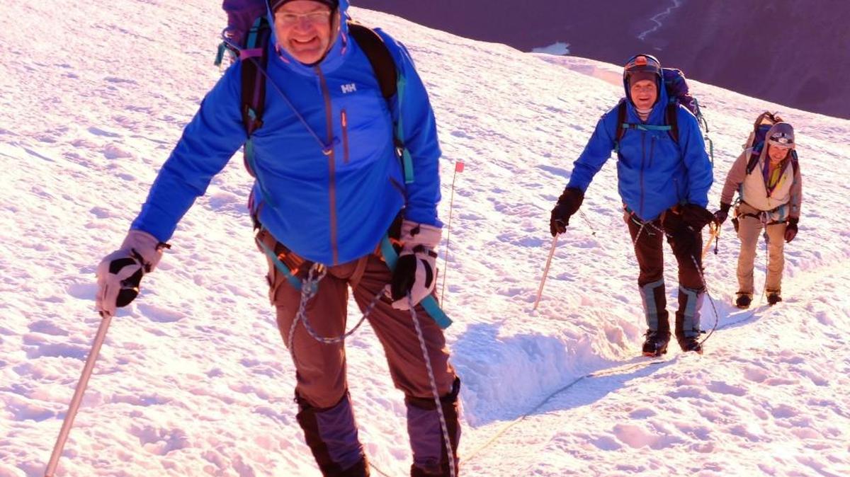 Troy Hodge, left, makes his way up Mount Rainier on Aug. 11 followed by his brother-in-law, Ryan Post, and Phil Nicoletti.