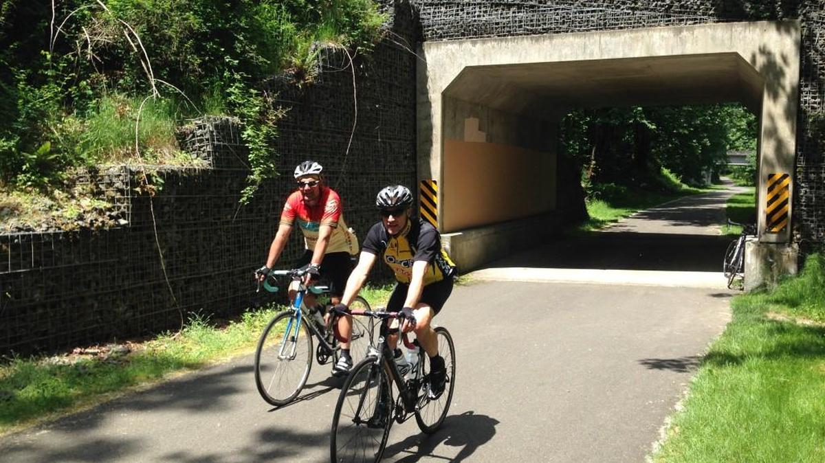 Rich Beitelspacher and Russ Meyers bike the Cedar River Trail in May.