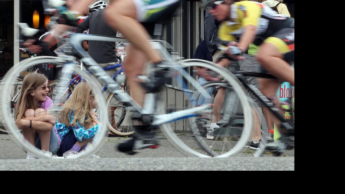 
Fans watch the Tacoma Twilight Criterium Race in 2012. Puyallup hosts a new criterium race this weekend. The Reliant Recovery Water Grand Prix includes a 2-mile running race.
